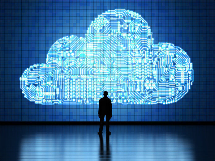 a person looking at a wall that make up an icon of a digital cloud